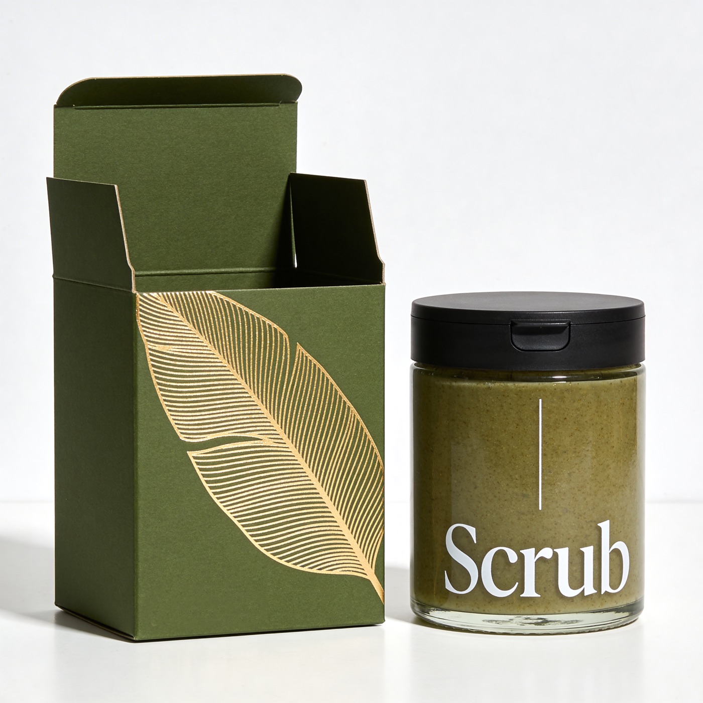 Scrub — тёмно-зелёная вырубная коробка с золотым тиснением листа