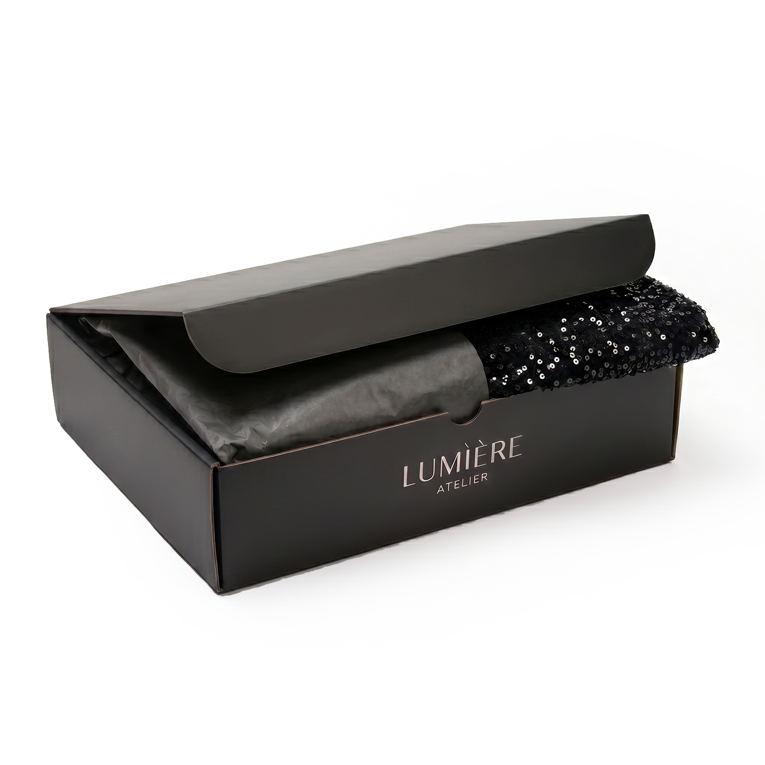 Lumière Atelier — чёрная вырубная коробка с серебряным логотипом для одежды, открытая