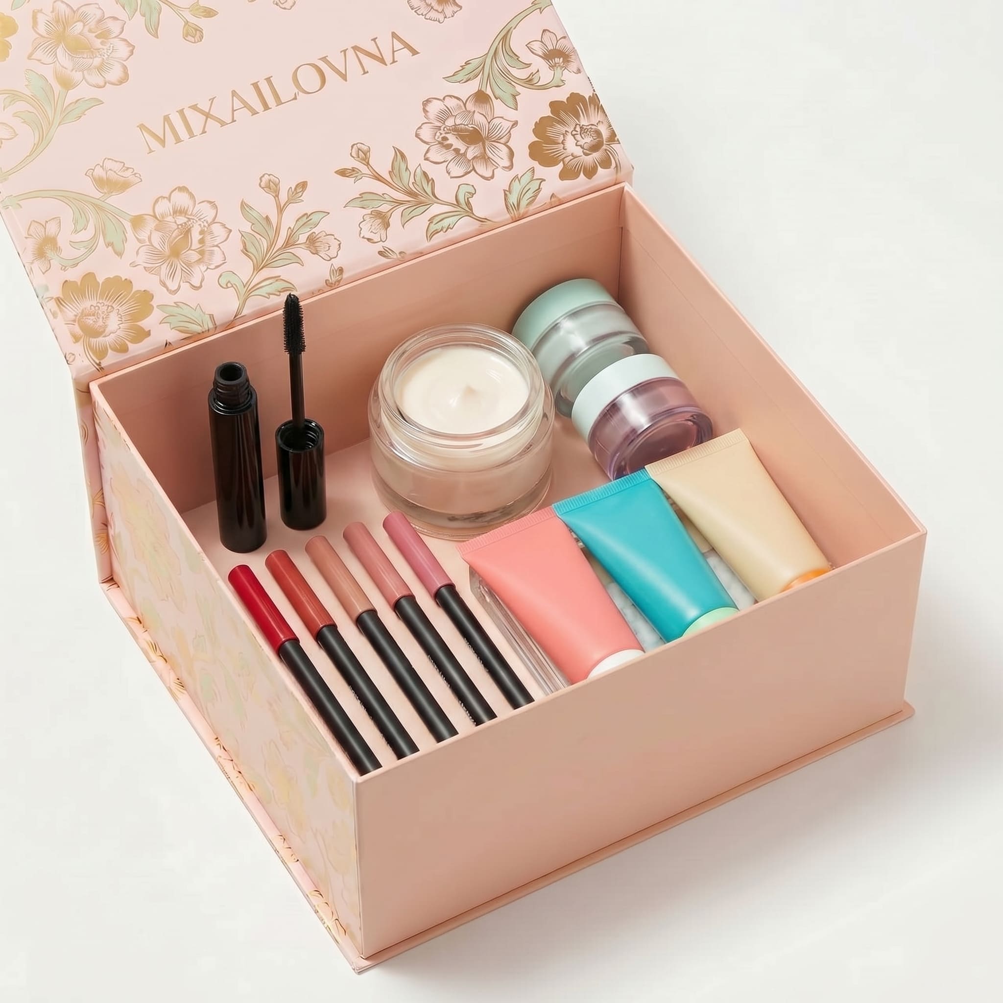 MIXAILOVNA — розовая коробка с цветочным принтом открытая, наполненная косметикой